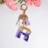 Nuevo Colgante de Gota de Cristal Morado Llavero con Letra Joyería de Resina Colgante de Borla para Bolso Regalos Europeo y Americano