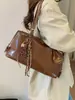 Bolsa de Axila de Nicho Transfronteiriça para Mulheres Outono e Inverno 2025 Nova Tendência Retrô Portátil para o Dia a Dia Bolsa de Ombro de Grande Capacidade