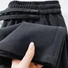 Pantalones casuales de cordón al por mayor transfronterizos, pantalones rectos holgados de pierna ancha con patchwork elástico de cintura alta simples y largos para mujer de otoño