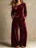 Conjunto de dos piezas de moda casual de terciopelo de estilo nuevo, transfronterizo europeo y americano 2026, pantalones anchos holgados y top de manga larga de un solo hombro para mujer