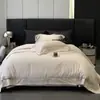 Venda Direta da Fábrica 100% Algodão Bordado Escovado Oco Conjunto de Quatro Peças Cor Simples Conjunto de Roupa de Cama Adequado para Todas as Estações Atacado