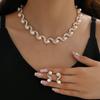Joyería al por mayor transfronteriza Europa y Estados Unidos explosiones damas perla de imitación en forma de S joyería nuevos accesorios de boda nupcial 985#