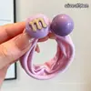 Elásticos de cabelo coloridos estilo 2026, versáteis e doces, com acessórios de M&M's, argolas de toalha, designs de desenhos animados e um estilo fresco e fofo, perfeitos para acessórios de cabelo infantis