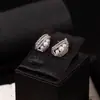 Clip de oreja de tornillo integrado de encaje con circonitas y perlas estilo francés de lujo ligero diseño de moda nicho pendientes de alta gama