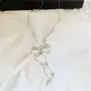 Elegante collar largo con borla y lazo transparente estilo francés para mujer, moderno, versátil, de alta gama, estiloso y elegante, cadena para suéter