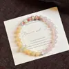 Pó de Flor de Pessegueiro Cultural e Criativo da Montanha Wutai Exclusiva Pulseira de Cristal Design de Círculo Único de Jade Persa para Mulheres, Sensação de Alto Padrão, Versátil para Encontros