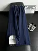 Pantalones de chándal de cuadros patchwork deconstruidos negros para hombre, marca de tendencia de otoño, pantalones rectos de alta gama que estilizan, pantalones de microcampana estilo americano