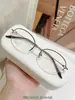Armazones de anteojos de titanio puro para mujer, estilo business tradicional, colección de anteojos de medio aro ultraligeros, armazón de anteojos Danyang M0043