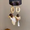 Pendientes de borla con carcasa de madera marrón transfronterizos europeos y americanos, pendientes de estilo vintage Maillard, pendientes de mujer de lujo ligero de alta gama
