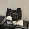 2026 Verão Novo Estilo Coreano Grande Capacidade para o Trabalho Ombro Único Bolsa de Axila Céu Estrelado Bolinhas Corrente Bolsa de Mão Atacado Mulheres