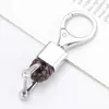 Llavero Coche hardware cuerda tejida metal colgante de alta gama hombres y mujeres pareja Cuero de microfibra resistente al desgaste Accesorios Venta al por mayor