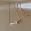 Collar con colgante de circonita cúbica en oro rosa para mujer, estilo coreano, de alta gama, ligero, nicho, cadena de suéter exquisita, accesorio versátil y elegante