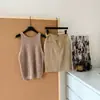 "Dinheiro velho solto" Colete de crochê resistente Versátil e emagrecedor + Cintura de Tencel Senso de Design Saia Midi