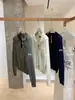Wgwe7947 Guangzhou Trece Líneas Ropa de Mujer 2025 Otoño Nuevo Estilo Suéter Top de Manga Larga con Cuello Polo Pequeño