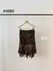 Producto auténtico oker. Diseño coreano con un estampado de leopardo irregular, dulce y fresco y dobladillo con volantes, falda de longitud media A1060