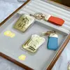 Oro Puro Feliz Lindo Dibujo Animado Oro Popular Hojuelas de Oro Cadena para Teléfono Móvil Cadena para Bolso Cadena para Llavero de Coche Adornos Regalos Venta al por Mayor