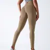 Pantalones de yoga ajustados de punto sin costuras de color liso de cintura alta, que levantan los glúteos, para deportes, correr y fitness, longitud de nueve puntos, transfronterizos europeos y americanos