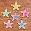 6 colores 29x32mm Accesorios de resina DIY Amuleto de animal Colgante de estrella de mar transparente Accesorios de decoración para bolsos y teléfonos