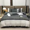 Juego de Cuatro Piezas de Seda Lavada de Comercio Exterior Verano con Relieve Sábana de Seda Helada Funda de Edredón Juego de Faldón de Cama Textiles para el Hogar Ropa de Cama