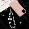 Cadena Minimalista para Teléfono con Perlas y Lazo, Correa de Muñeca, Cadena de Mano, Portacámaras y Llavero para Mujer