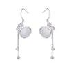 Aretes de bolsa de la suerte de piedra ojo de gato sintético para mujer, aretes de borla de moneda estilo chino de lujo ligero, aretes de calcita anti moda temperamento