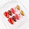 Puntas de Uñas Portátiles de Metal Doradas con Rayas Rojas Almendradas Hechas a Mano 10 Piezas con Tallas Venta Caliente Transfronteriza Suministro Directo de Fábrica de Uñas Portátiles