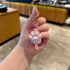Nuevo llavero pequeño de paleta Sanrio, colgante para mochila para niñas, linda decoración para coche y bolso, pequeño regalo promocional