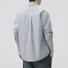 Camisa de hombre de tela Oxford a rayas estilo japonés 2026 nuevo otoño algodón puro cuello camisero manga larga chaqueta venta al por mayor