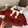 Ropa Infantil Estilo Coreano 2025 Nuevo Otoño e Invierno Suéter para Niñas con Pompón y Lazo Año Nuevo Falda de Pastel Rojo Conjunto de Dos Piezas Moderno