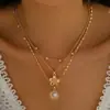 Collar en Capas de Perlas con Colgante de Concha Floral de Venta Caliente Europea y Americana, Cadena Larga de Suéter Versátil Retro de Moda para Otoño e Invierno
