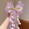 Novo Estilo de Primavera Laço Flor de Lírio do Vale Doce e Fofo Acessório de Cabelo para Meninas, Adequado para Uso Diário e Trajes Tradicionais, com Presilha de Cabelo com Fita Longa
