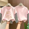 Camiseta base de manga larga tipo dos piezas para niña, nuevo estilo primavera/otoño 2026, camiseta de algodón puro con cuello redondo, corte holgado para niños mayores