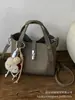 Bolso de Mano de Alta Gama para Mujer 2026 Nuevo Bolso Cruzado Versátil de Moda Super Popular Bolso Pequeño Tote Tipo Cubo