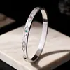 Europa e Estados Unidos transfronteiriço novo diamante ins sol olhos diamante ouro 18K personalidade moda pulseira de aço inoxidável feminina all-match