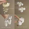 Pendientes de metal retro francés con diseño de nicho de flores blancas, elegantes pendientes geométricos femeninos con temperamento, joyería al por mayor