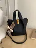 Bolso Cubo Retro Texturizado Estilo Coreano para Mujer Otoño e Invierno 2025 Nuevo Nicho Lujo Accesible Versátil Estilo Extranjero Bolso de Hombro Único Cruzado
