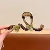 Elegante pinza de garra floral para peinado semi-recogido, nuevo modelo 2026 para mujer, pinza de tiburón de tamaño mediano para la parte trasera de la cabeza, accesorio para el cabello
