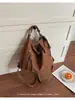 Bolsa feminina transfronteiriça 2026 início da primavera nova versátil vintage cor sólida camurça grande capacidade bolsa de ombro bolsa tiracolo