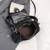 Bolso de almohada retro de nicho estilo coreano para mujer, bolso de hombro y axila a la moda, nuevo bolso cruzado elegante y único de primavera 2026