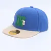 Gorra de Béisbol para Bebé Estilo Europeo y Americano con Bloques de Color Sombrero de Sol Venta al por Mayor Moda Primavera y Verano Gorra Hip-Hop de Ala Plana con Letras Sombrero de Sol