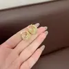Pendientes de bola hueca de personalidad europea y americana exagerada con material, moda de conversación fría, temperamento, lujo ligero, alta sensación, joyería para la oreja