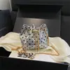 Moda de Verano Bolso Cruzado Sencillo de Lunares con Cadena para Mujer 2026 Nuevo Bolso Cubo de Cordón de Color Sólido Bolso Nube