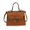 Bolsa de Ombro Casual Retrô 2026 Nova Moda Simples Fivela de Fechadura Pequena Bolsa de Ombro Quadrada Estilo Coreano Bolsa Transversal para Mulheres