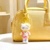 Pingente de flocado de desenho animado, chaveiro de gato KT de pernas longas para trabalhadores de escritório, brinquedo de pelúcia flocado da moda, pingente de bolsa, atacado