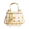 Bolsa mini personalizada para labiales transfronteriza 2026, nueva bolsa cruzada tachonada primavera/verano, bolso de hombro versátil y de moda para mujer