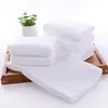 Venta al por mayor de fábrica Toallas Blancas Alojamiento de Hotel Baño Salón de Belleza 30*70 Tejido de Punto por Urdimbre Borde Cortado Microfibra