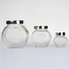 Venta al por mayor, botella de vidrio plana de 180 ml, para especias, miel, mermelada, caramelos, té, semillas y flores.