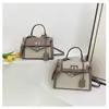 Bolsos estilo nuevo candado bolso Kelly, bolso de mano de moda europeo y americano con bloques de color para mujer, bolso cruzado de hombro texturizado y empalmado
