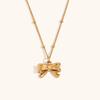 Moda transfronteriza europea y americana acero inoxidable chapado en oro de 18 quilates mini cadena de cuentas clásica colgante de lazo aretes de botón collar para mujer