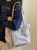 Bolsa de mano Shuai Mi Jia de gran capacidad 2026 nueva de moda bolso de mano simple moda femenina bolso de hombro casual